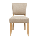 Beige upholstered chair with wooden legs on a white background