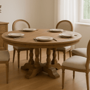 Dining room with wooden table and chairs, set for a meal.
