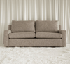 A natural tanned colour two seater sofa.