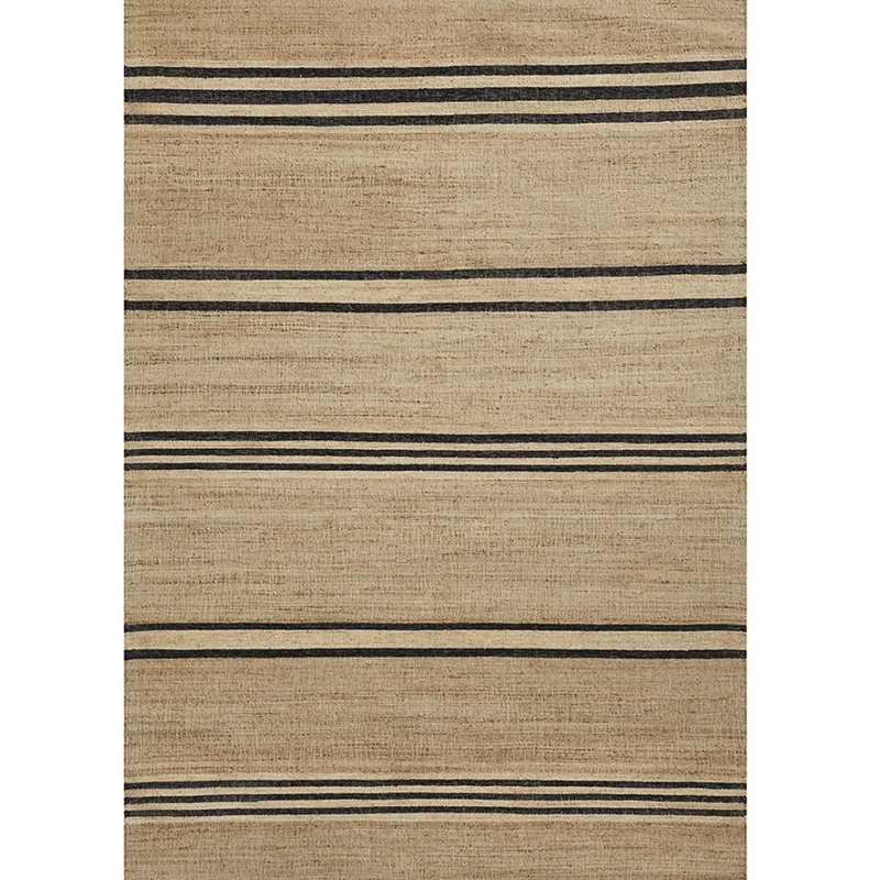 A natural rug with horizontal black stripes.
