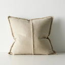 Beige pillow with a textured finish on a light gray background