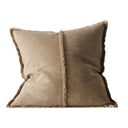 Two-tone brown pillow with frayed edges on a white background