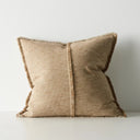 Beige pillow with textured fabric on a light gray background