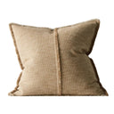 Beige pillow with frayed edges on a white background