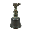 Bronze bell with intricate designs on a white background