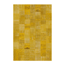Yellow patchwork rug on a white background