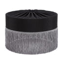 A black lampshade with a gathered top and a long fringe trim in a light gray or silver tone, shown on a plain white background.