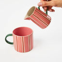 Two striped mugs in pink, red and white
