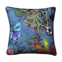 Decorative blue pillow with floral and butterfly design on a white background