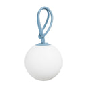 White spherical lamp with a blue strap on a white background