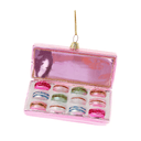 Pink glass Christmas ornament shaped like a box of colourful macarons with glitter detailing.
