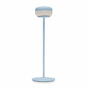 Light blue lamp with a cylindrical shade on a white background