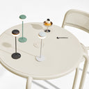 Round table with various Fatboy Cheerio Table Lamps on a white background