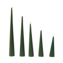 Five green cone-shaped candles of varying heights on a white background