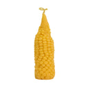 Corn-shaped candle on a white background