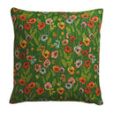 Floral-patterned pillow with red, orange, and yellow flowers on a green background
