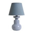 Dusty blue lamp with a matching shade on a white background