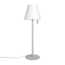 Grey floor lamp with a white shade on a white background