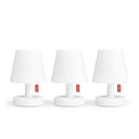 Set of three white Fatboy Edison the Mini lamps on a white background