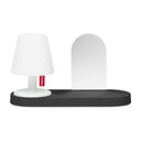 White lamp on a black wallmount as a base on a white background