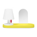 Small white lamp with a yellow wall mount base on a white background