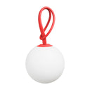 White lamp with a red handle on a white background