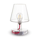 Clear table lamp with visible bulb on a white background