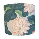 Decorative lampshade with water lilies and leaf design on a white background
