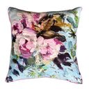Floral-patterned pillow with pink, purple, and green colors on a white background