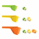 Three citrus juicers in green, yellow, and orange with citrus fruits on a white background
