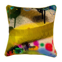 Colorful abstract-patterned pillow on a white background