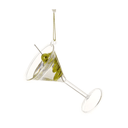 A clear glass martini-style hanging ornament shaped like a tilted martini glass filled with green olives on a pick, suspended by a gold string against a white background.