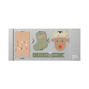 Packaging with Christmas-themed items including a reindeer, sock, and banner on a white background.
