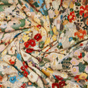 Close-up of a colorful floral fabric with various patterns.