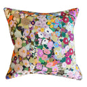 Multicolored floral patterned pillow on a white background