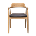 Wooden chair with black leather seat on a white background