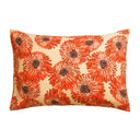 Decorative pillow with orange floral pattern on a beige background