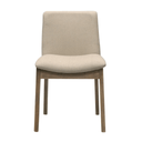 Beige upholstered chair with wooden legs on a white background