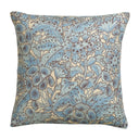 Floral patterned pillow with blue and beige colors on a white background