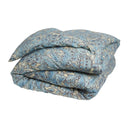 Blue floral patterned comforter on a white background