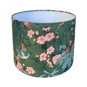 Floral and bird patterned lampshade on a white background
