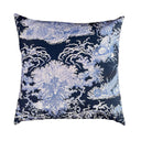 Decorative pillow with blue and white marine design pattern on a navy background