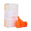 Candle package with a small orange hand giving a thumbs-up gesture on a white background