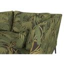 Green leaf-patterned sofa on a white background