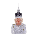 A bust-shaped Christmas ornament depicting Queen Camilla wearing a jeweled silver and black crown and a white embroidered gown, shown on a plain white background.
