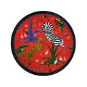 Round red plate with a zebra and leopard design on a white background
