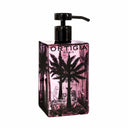 Pink soap glass bottle with palm tree design and Ortigia Sicilia branding on a white background