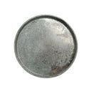Round metal tray with a textured surface on a white background