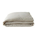 Folded beige duvet cover on a white background