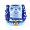 Ceramic vase shaped like a dog's head with blue fur and a gold collar on a white background
